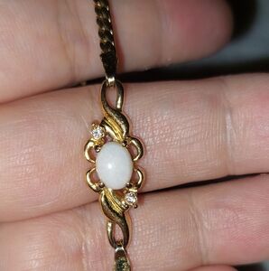 Avon Elegant Goldtone Bracelet with Opal and Diamond Like Accents